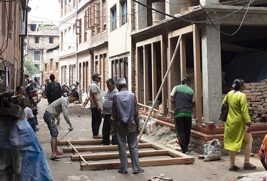 Photo, assembling doorframes for a new building, Old Patan, Nepal.